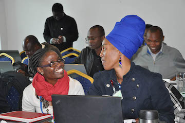 Joyce Mumah, Associate Research Scientist, APHRC, and Marilyn Wamukoya, Data Analyst, APHRC, work together on an exercise at the Nairobi training (photo by APHRC).