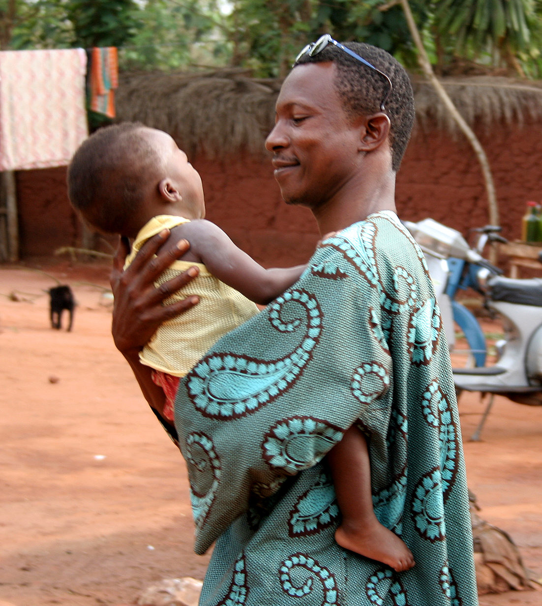 African man holding baby