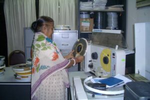 Woman in Bangladesh processing historical microdata